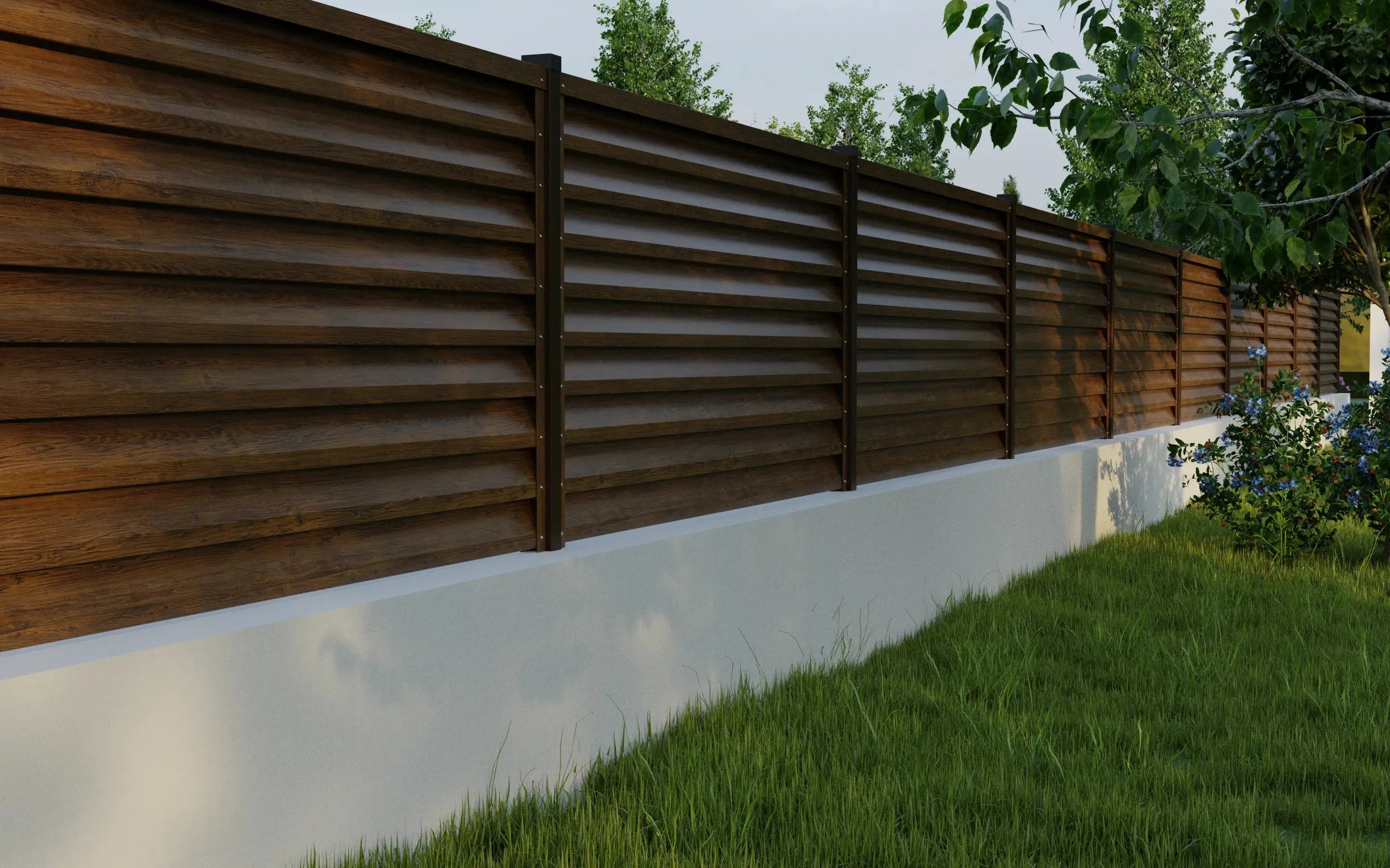 Wooden privacy fence with a white base and greenery in the background
