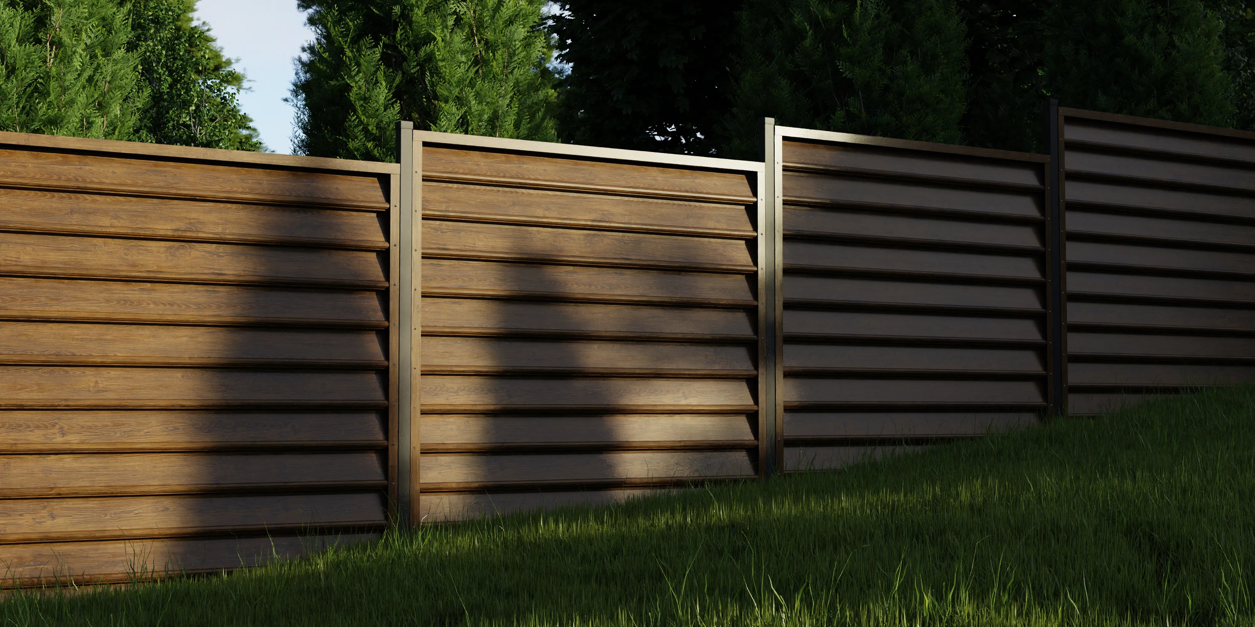 Wooden fence with a grassy area and trees in the background