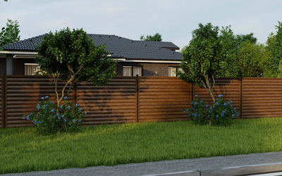 House with a wooden fence and greenery